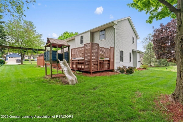 3720 Lott Ave, Holt, MI 48842 - rear view of property featuring a playground and a lawn
