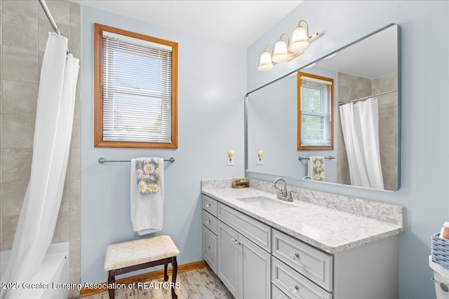 3720 Lott Ave, Holt, MI 48842 - bathroom with vanity, wood finished floors, and shower / bathtub combination with curtain