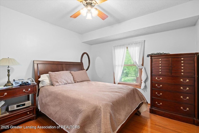 3720 Lott Ave, Holt, MI 48842 - bedroom with wood finished floors and ceiling fan
