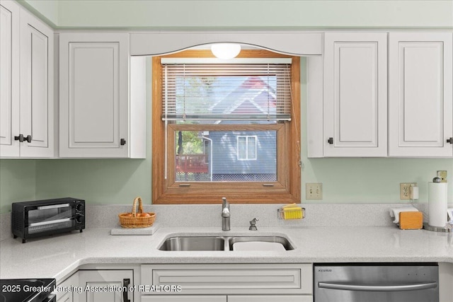 3720 Lott Ave, Holt, MI 48842 - kitchen featuring a sink, stainless steel dishwasher, range with electric stovetop, white cabinetry, and light countertops