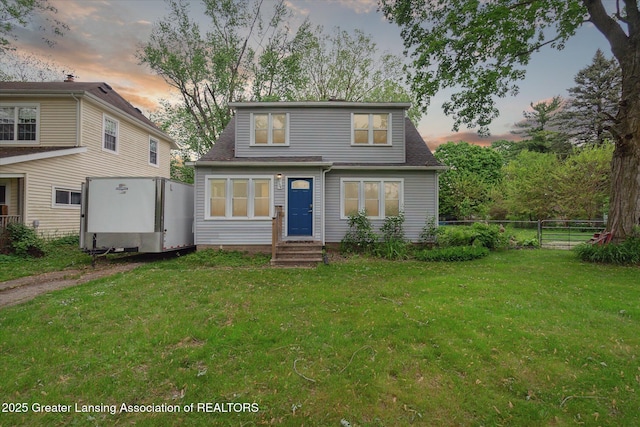 5104 Old Lansing Rd, Lansing, MI 48917 - view of front facade with entry steps and a shingled roof