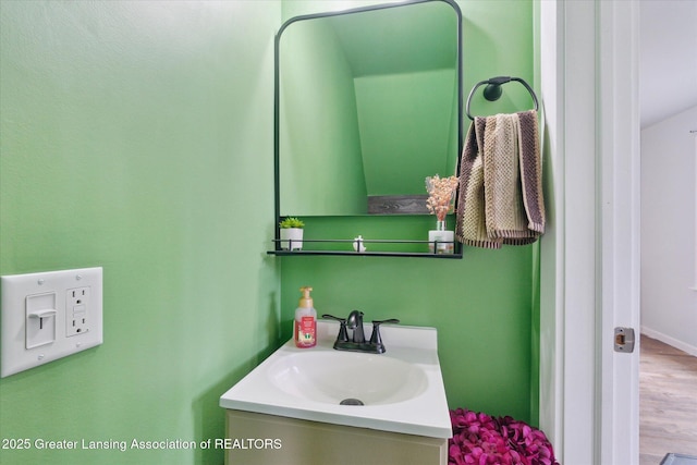 5104 Old Lansing Rd, Lansing, MI 48917 - bathroom with vanity and wood finished floors