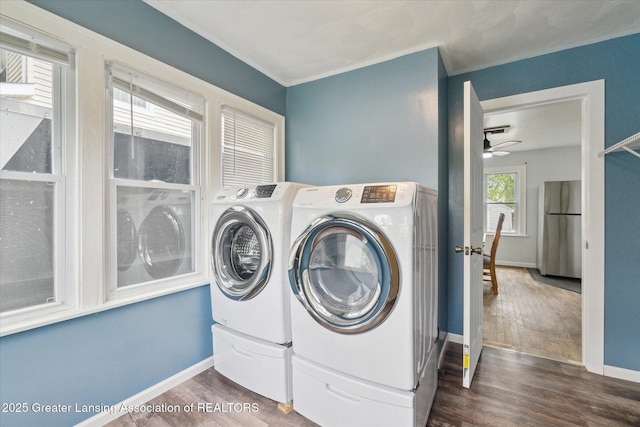 5104 Old Lansing Rd, Lansing, MI 48917 - clothes washing area with washer and dryer, dark wood-style flooring, baseboards, and a ceiling fan