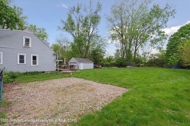 5104 Old Lansing Rd, Lansing, MI 48917 - view of grassy yard featuring an outbuilding