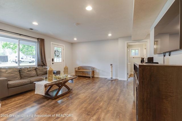 4614 Addison Rd, Lansing, MI 48917 - living area with wood finished floors, recessed lighting, and baseboards