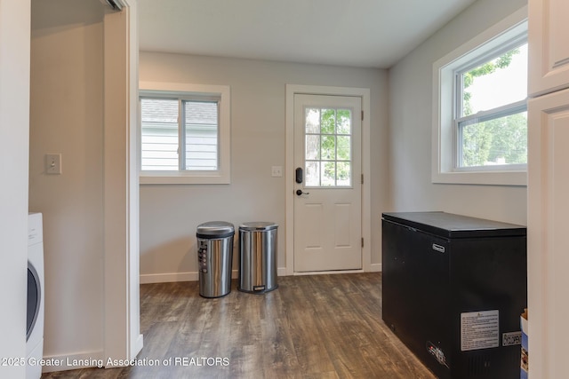 4614 Addison Rd, Lansing, MI 48917 - laundry area with dark wood finished floors, baseboards, and washer / clothes dryer