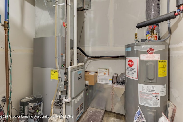 4614 Addison Rd, Lansing, MI 48917 - utility room featuring electric water heater and heating unit