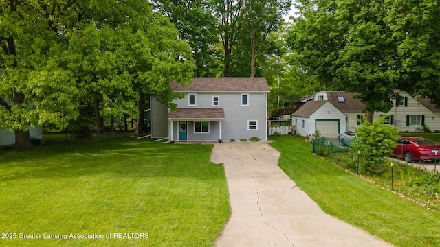 4614 Addison Rd, Lansing, MI 48917 - traditional-style home with an outdoor structure, concrete driveway, and view of scattered trees