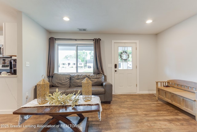 4614 Addison Rd, Lansing, MI 48917 - living area with light wood-type flooring, recessed lighting, and baseboards