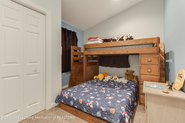 4614 Addison Rd, Lansing, MI 48917 - carpeted bedroom featuring lofted ceiling and baseboards