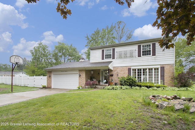 3733 Colchester Rd, Lansing, MI 48906 - traditional home featuring brick siding, a garage, and concrete driveway