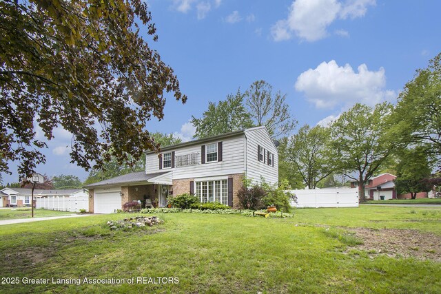 3733 Colchester Rd, Lansing, MI 48906 - traditional home featuring brick siding and an attached garage