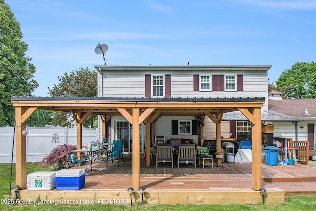 3733 Colchester Rd, Lansing, MI 48906 - back of property featuring outdoor lounge area and a wooden deck