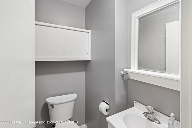 1111 Battle Creek Rd, Charlotte, MI 48813 - half bath featuring toilet and vanity