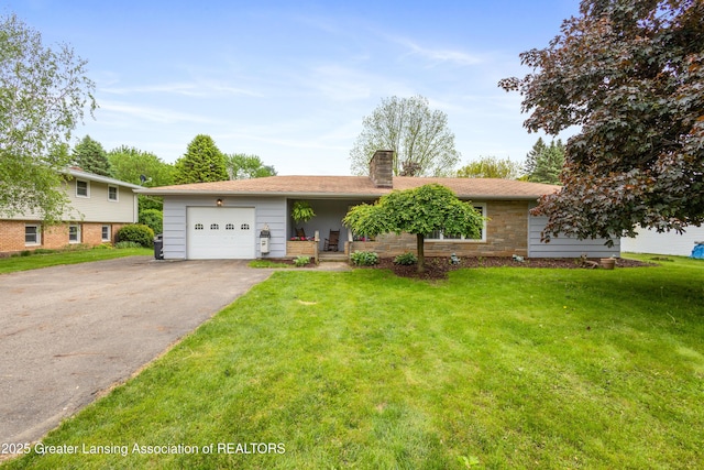 1111 Battle Creek Rd, Charlotte, MI 48813 - view of front facade with a chimney, driveway, an attached garage, a front lawn, and stone siding