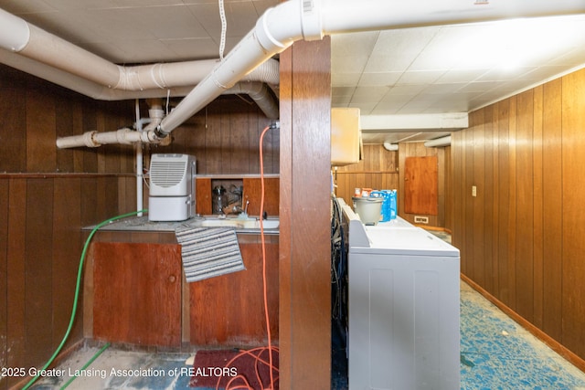 1111 Battle Creek Rd, Charlotte, MI 48813 - washroom with washer / dryer and wooden walls