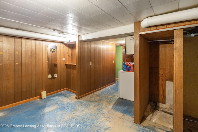 1111 Battle Creek Rd, Charlotte, MI 48813 - finished below grade area with wood walls, washer / dryer, and baseboards