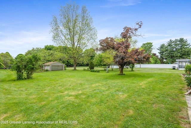 1111 Battle Creek Rd, Charlotte, MI 48813 - view of yard featuring a garage and an outbuilding