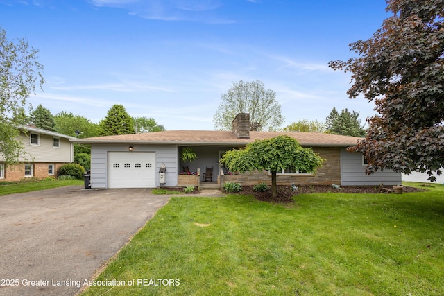 1111 Battle Creek Rd, Charlotte, MI 48813 - view of front of home with a chimney, driveway, a front lawn, and an attached garage