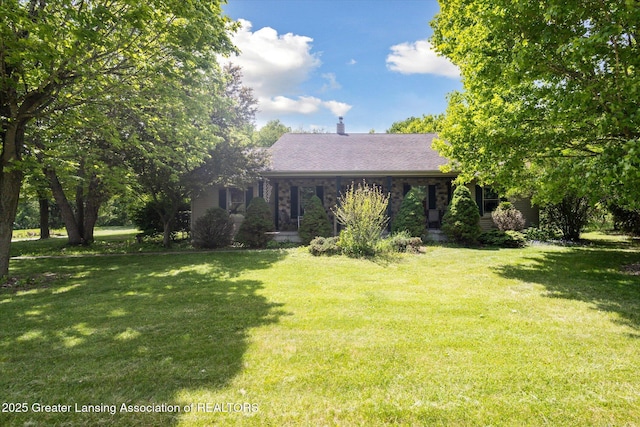 1435 Epley Rd, Williamston, MI 48895 - single story home featuring a front yard, a chimney, and roof with shingles