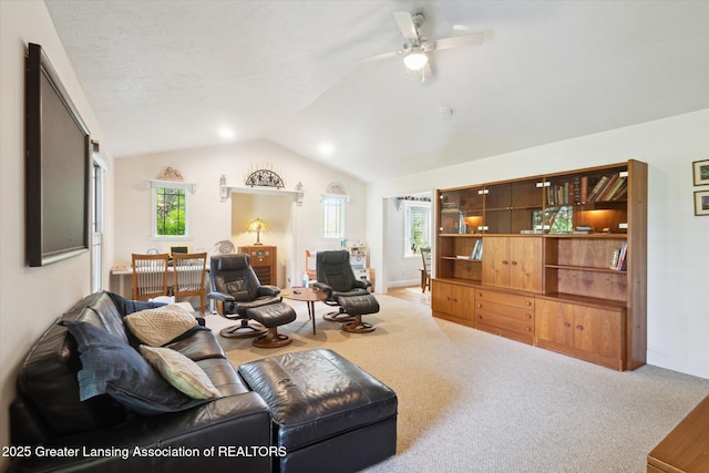 1435 Epley Rd, Williamston, MI 48895 - living area featuring vaulted ceiling, a ceiling fan, carpet floors, and baseboards
