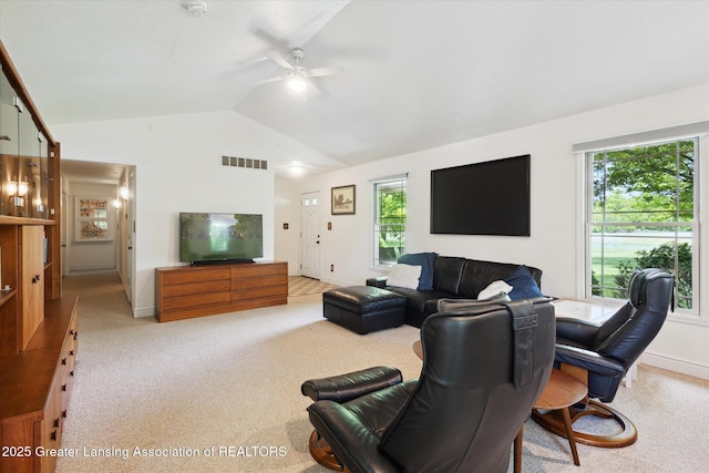 1435 Epley Rd, Williamston, MI 48895 - living area with lofted ceiling, a ceiling fan, carpet floors, and plenty of natural light