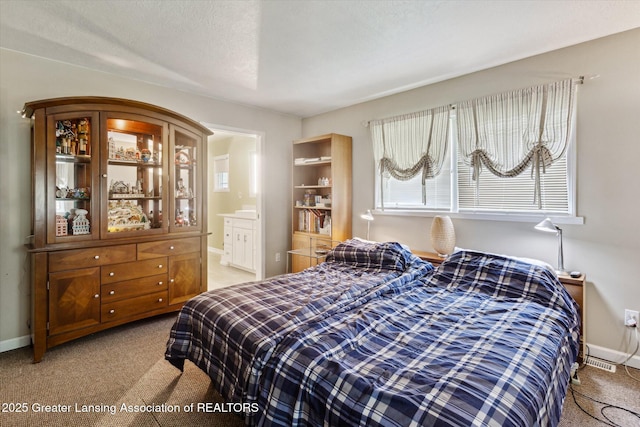 1435 Epley Rd, Williamston, MI 48895 - bedroom with carpet flooring, baseboards, and ensuite bath