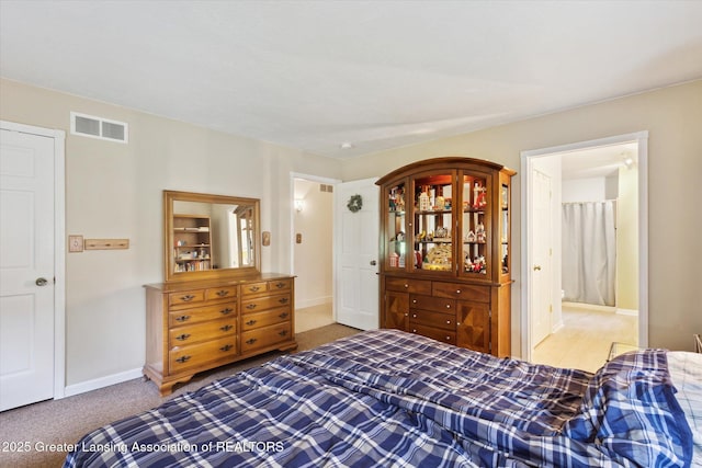 1435 Epley Rd, Williamston, MI 48895 - carpeted bedroom featuring baseboards and ensuite bath