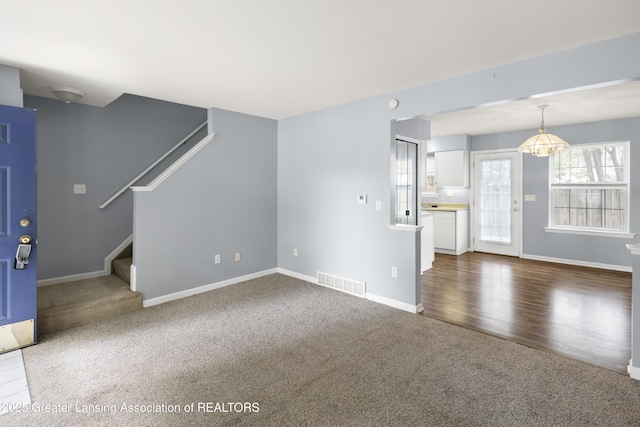 6215 Beechfield Dr, Lansing, MI 48911 - unfurnished living room with dark carpet, stairs, and baseboards