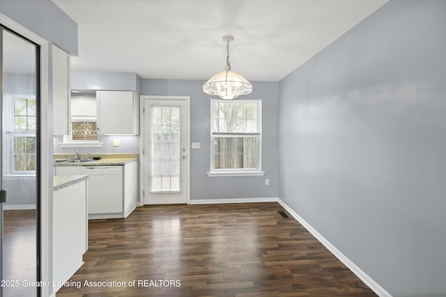 6215 Beechfield Dr, Lansing, MI 48911 - kitchen featuring dishwasher, a chandelier, white cabinets, and dark wood finished floors