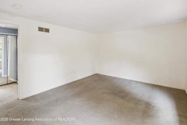 6215 Beechfield Dr, Lansing, MI 48911 - empty room with carpet floors, baseboards, and a smoke detector