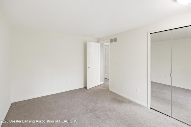 6215 Beechfield Dr, Lansing, MI 48911 - unfurnished bedroom with carpet floors and a closet