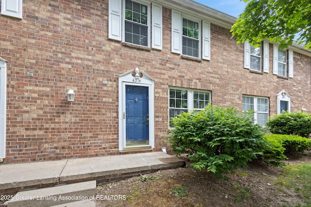6215 Beechfield Dr, Lansing, MI 48911 - doorway to property featuring brick siding