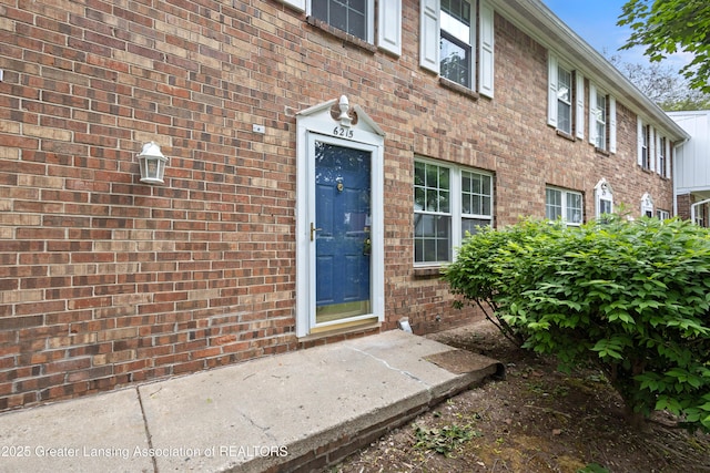 6215 Beechfield Dr, Lansing, MI 48911 - view of exterior entry featuring brick siding