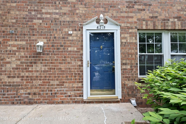 6215 Beechfield Dr, Lansing, MI 48911 - doorway to property featuring brick siding