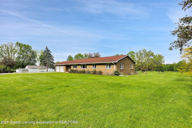 847 N Waverly Rd, Dimondale, MI 48821 - single story home featuring an attached garage, a front yard, and brick siding