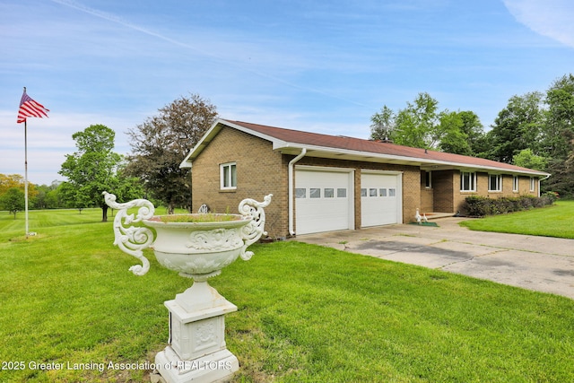 847 N Waverly Rd, Dimondale, MI 48821 - view of front of property featuring an attached garage, driveway, a front lawn, and brick siding