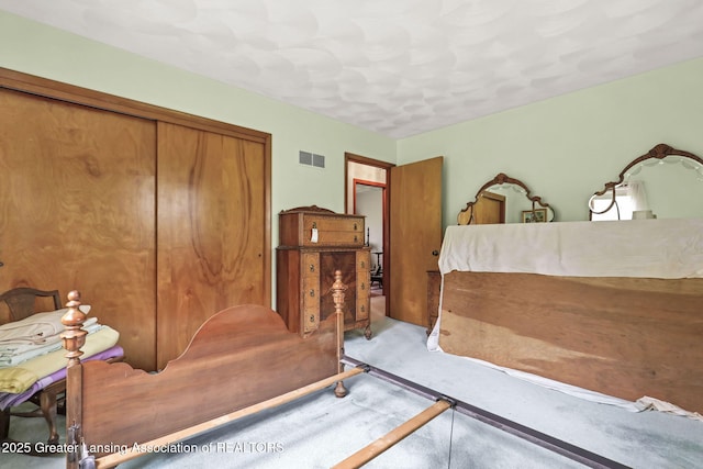 847 N Waverly Rd, Dimondale, MI 48821 - bedroom with carpet floors and a closet