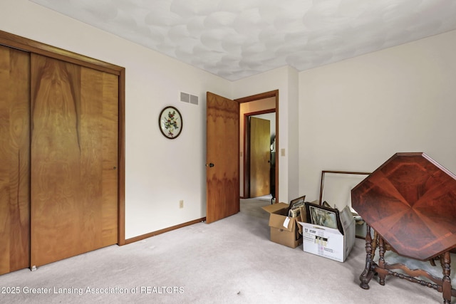 847 N Waverly Rd, Dimondale, MI 48821 - bedroom featuring carpet floors, a closet, and baseboards