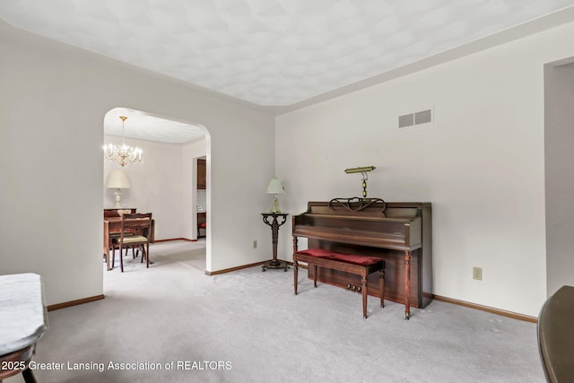 847 N Waverly Rd, Dimondale, MI 48821 - sitting room with arched walkways, carpet flooring, baseboards, and a chandelier