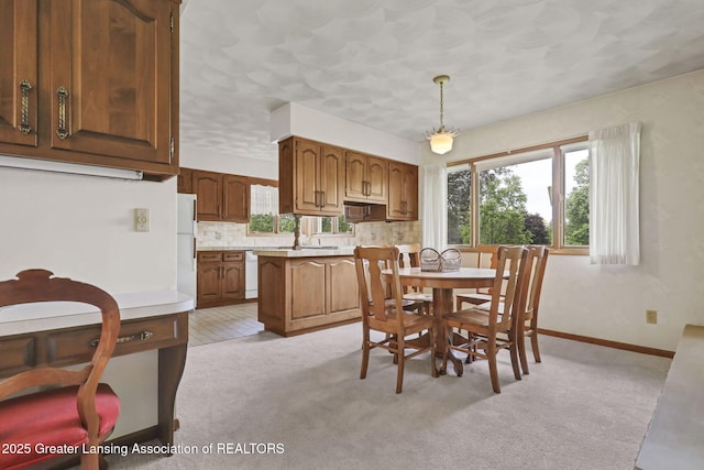 847 N Waverly Rd, Dimondale, MI 48821 - dining space featuring light colored carpet, baseboards, and a textured ceiling