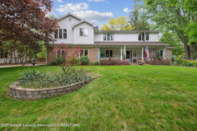 1866 Birchwood Dr, Okemos, MI 48864 - view of front of home featuring a porch, a front yard, and brick siding