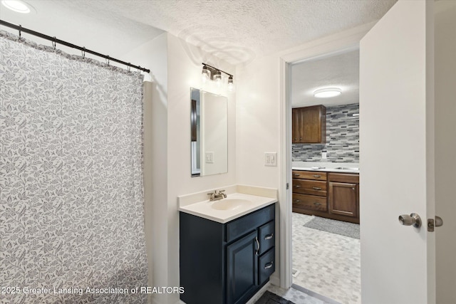 1900 Kaplan St, Lansing, MI 48917 - bathroom with a textured ceiling, vanity, decorative backsplash, and a shower with curtain