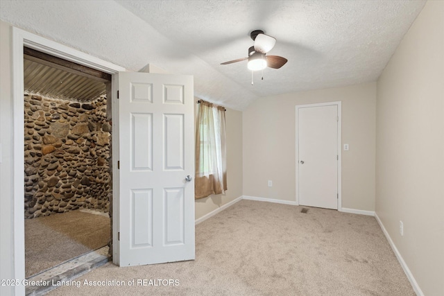 1900 Kaplan St, Lansing, MI 48917 - unfurnished bedroom featuring light carpet, a textured ceiling, baseboards, and a ceiling fan