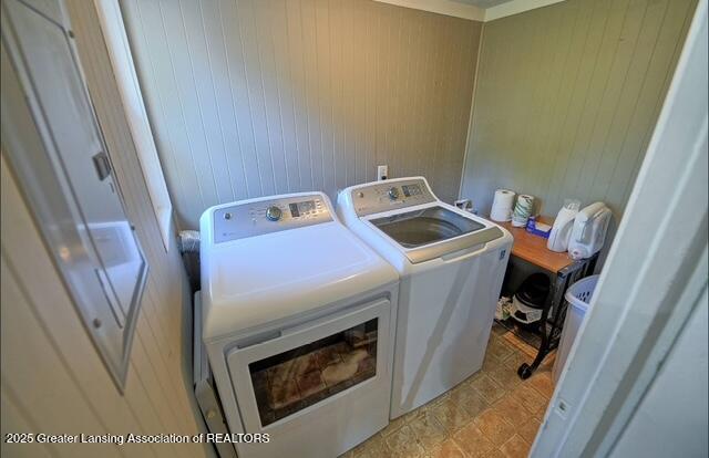 711 W Henry St, Charlotte, MI 48813 - laundry area with separate washer and dryer and wooden walls