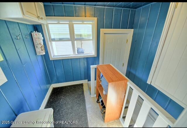 711 W Henry St, Charlotte, MI 48813 - mudroom with wood walls and baseboards