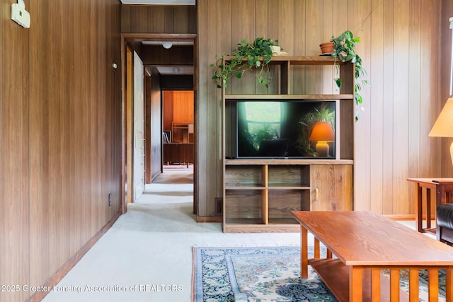 3129 Birch Row Dr, East Lansing, MI 48823 - carpeted living room featuring wooden walls