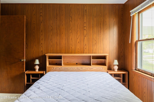 3129 Birch Row Dr, East Lansing, MI 48823 - bedroom featuring wood walls