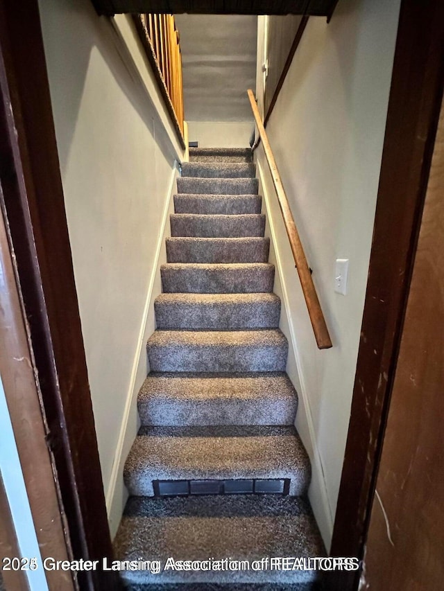 13862 Hartel Rd, Grand Ledge, MI 48837 - stairs with carpet flooring and baseboards