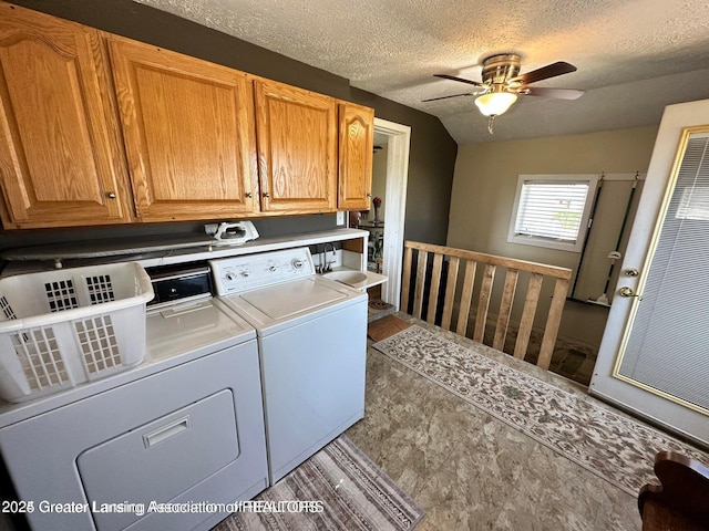 13862 Hartel Rd, Grand Ledge, MI 48837 - washroom with separate washer and dryer, cabinet space, a ceiling fan, and a textured ceiling